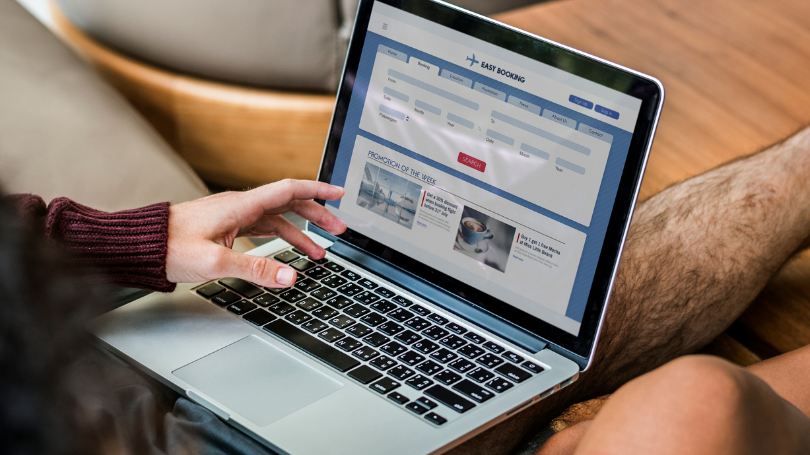 man checking a scalable website design in dallas on his computer man checking a scalable website design in dallas on his computer