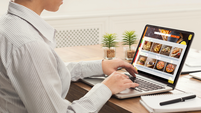 woman checking on a website that scales dallas on her computer woman checking on a website that scales dallas on her computer