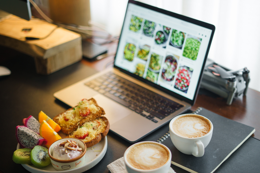 a dallas restaurant website and foods on a table