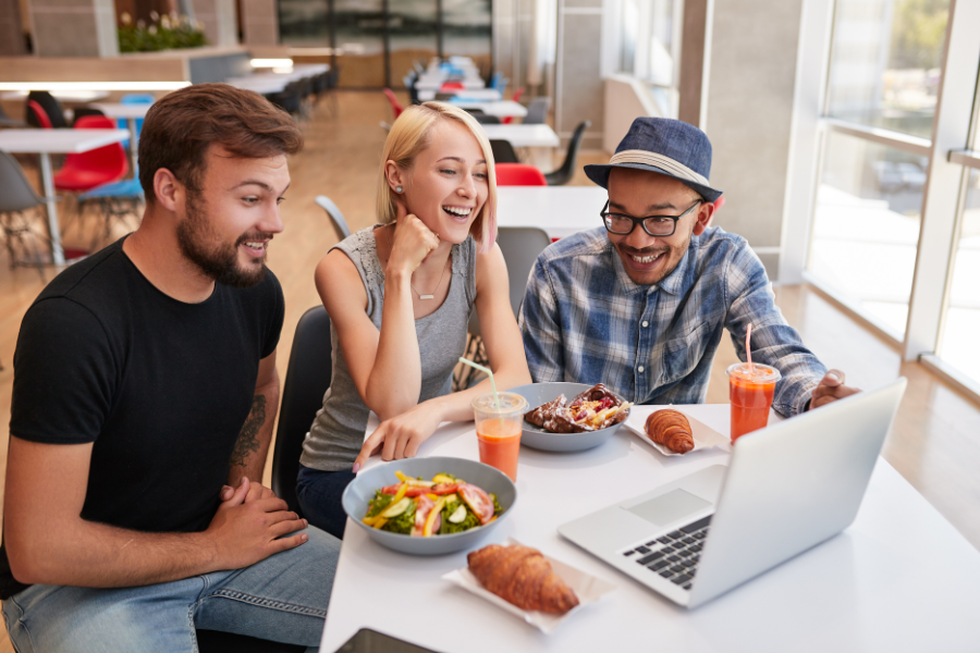 a team checking a restaurant website on a laptop