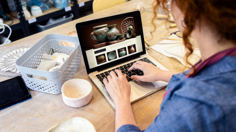 a woman checking an affordable website on her computer a woman checking an affordable website on her computer