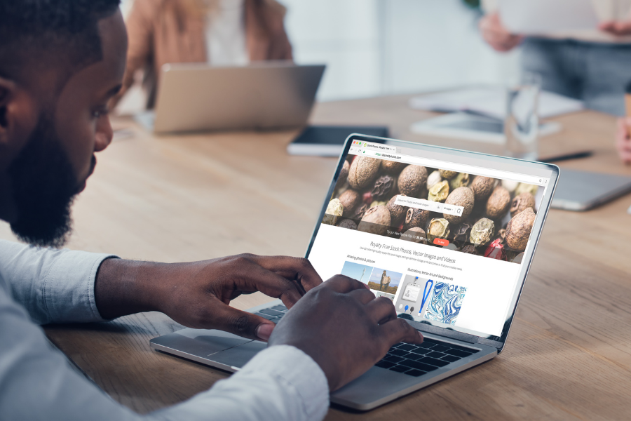 a man checking on a website design on his laptop a man checking on a website design on his laptop
