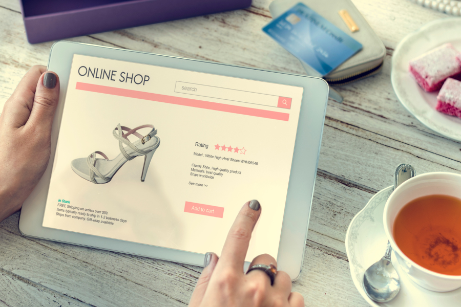 a woman shopping shoes on a tablet a woman shopping shoes on a tablet