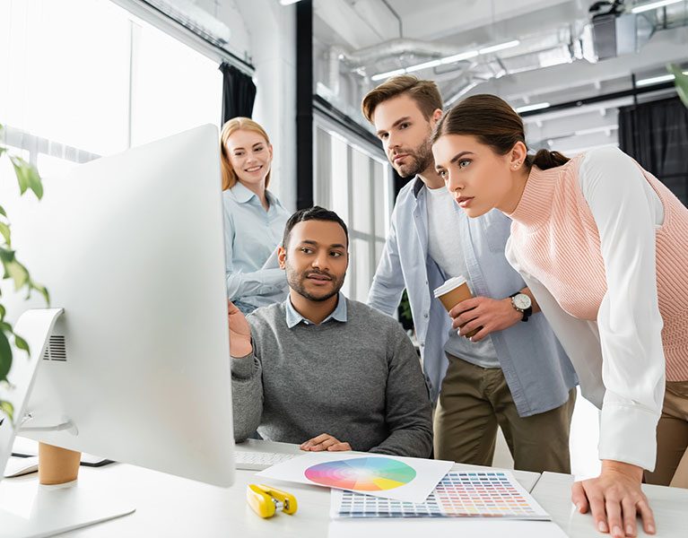office-team-collaborating-on-design-project-at-com